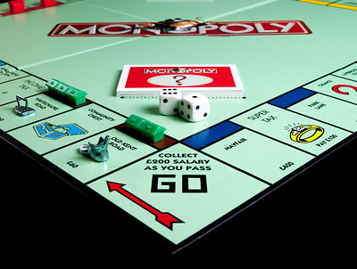 Photo showing part of the monopoly game board, from the corner with the "Go" square.